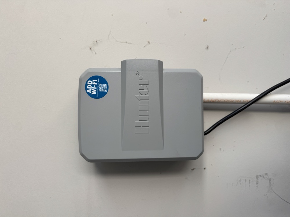Hunter irrigation controller mounted on a garage wall